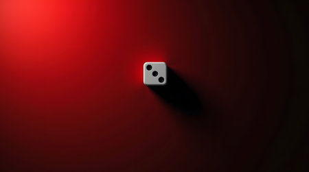 Roll the dice and take a chance for success with this vibrant three spot die on deep red backgroundの素材