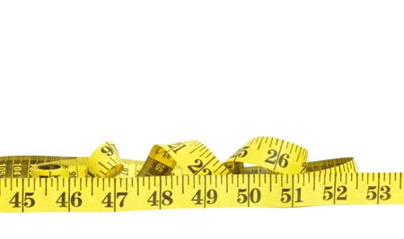 Yellow measure tape on white background