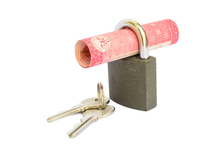 Hundred rupee Pakistani currency note rolled in a padlock. Money security concept,