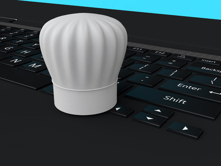 3d chef hat on laptop keyboardの写真素材