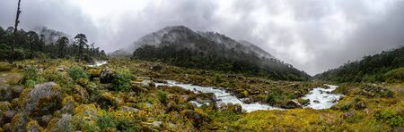 a beautiful mountain panorama view with river and cloudsの写真素材