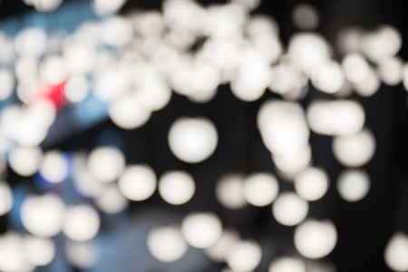 Abstract defocused round lights on a black background.の写真素材