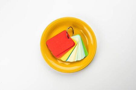 Yellow plate with a color palette, top view