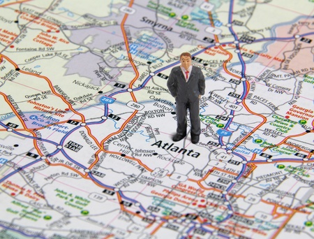 Business man figure standing on a map of Atlanta Georgia, USA.の写真素材
