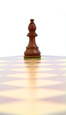 Wooden chess bishop on a diagonal line の写真素材