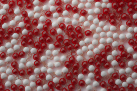 red and white beads on a white background close-up macro photography. generative aiの素材