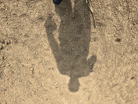Shadow of a man standing on the ground with shadow of a man