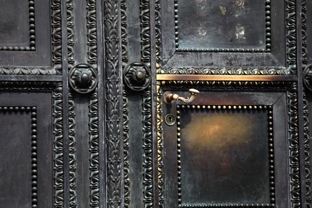 fragment of an ancient copper doorsの写真素材