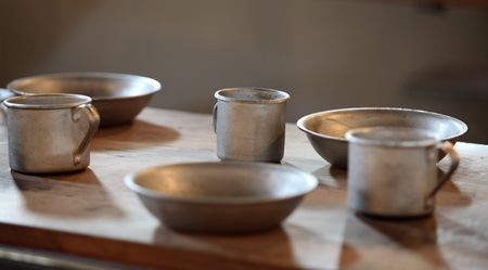 The old aluminum utensils on the table in the chamberの写真素材