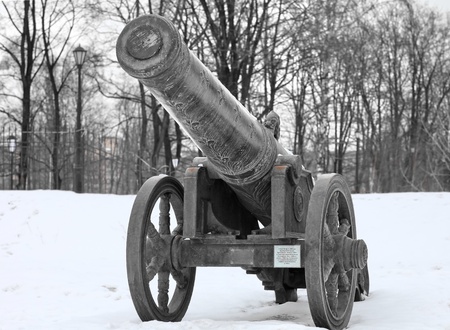 The old medieval bronze cannon on the gun carriageの写真素材