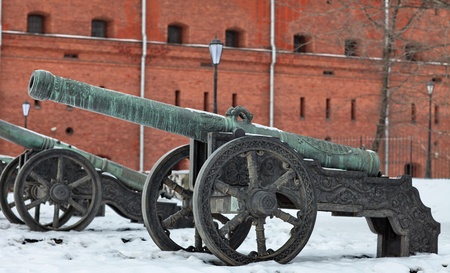 The old medieval bronze cannon on the gun carriageの写真素材