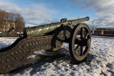 The old medieval bronze cannon on the gun carriageの写真素材