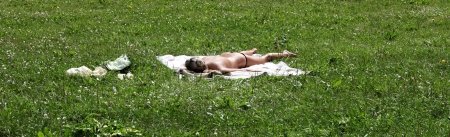 the girl sunbathing toplessの写真素材