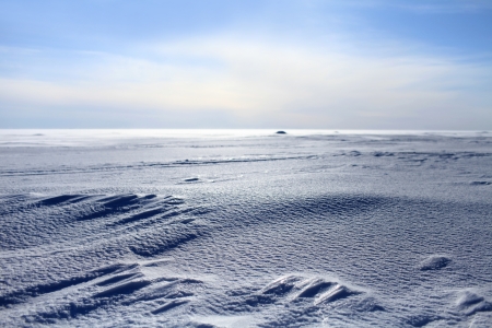 frozen sea looking like white snowy desertの写真素材