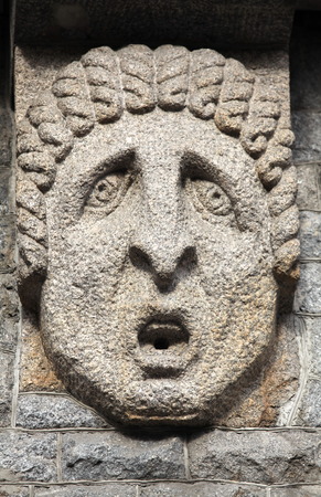 Old fountain relief without waterの写真素材