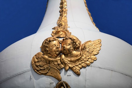 A pair of golden angels on the church domeの写真素材