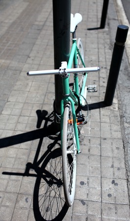 green bicycle and its shadowの写真素材