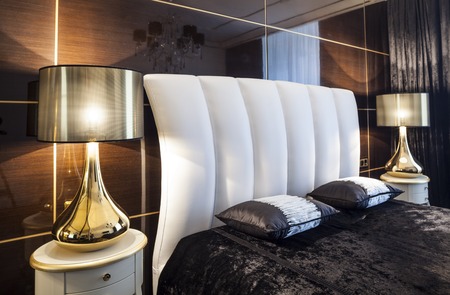 home Interior luxury modern bedroom bed and table lampsの写真素材