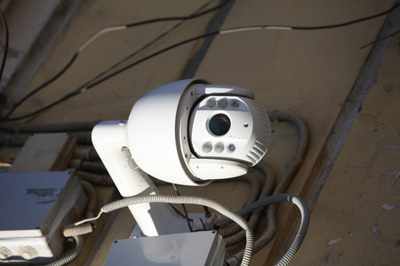 outdoor surveillance video camera in the wallの写真素材