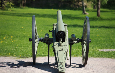 Old cannon rear view on a green background shallow depth of fieldのeditorial素材