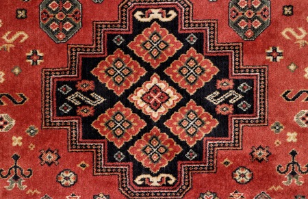 geometric  pattern old Persian carpet closeup