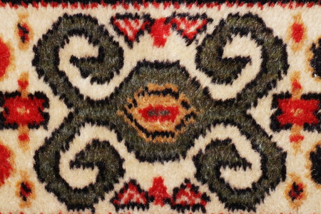 geometric  pattern old Persian carpet closeup