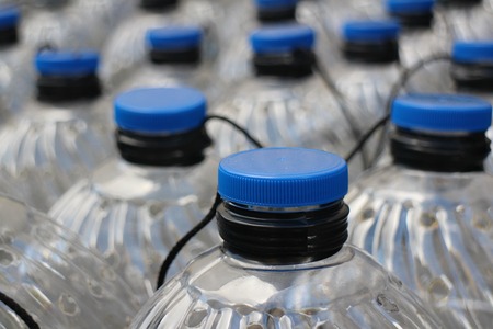 Rows translucent plastic bottles close toの写真素材