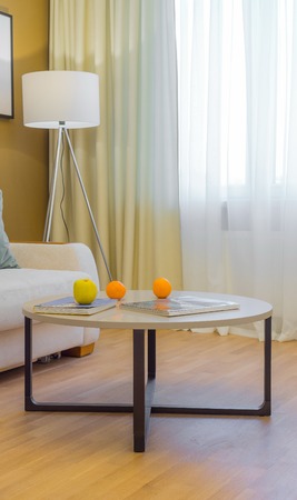 Journal table with oranges in the living  interiorの写真素材