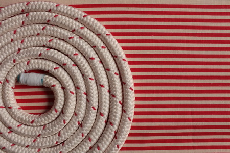 Rope round spiral red striped flat lay backgroundの写真素材