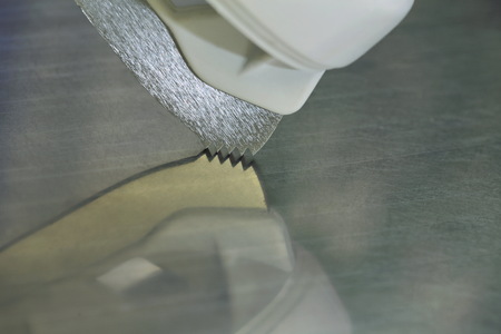 Sharp teeth of a skate with reflection, concept movement, speed, runningの写真素材