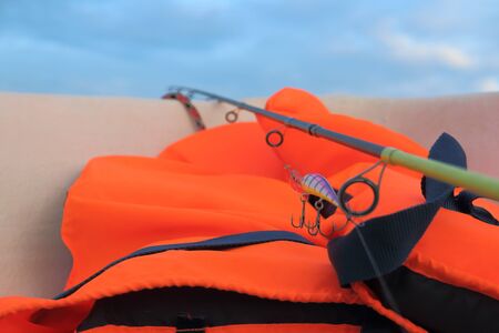 orange lifejacket is necessary when catching predatory fish in the seaの写真素材