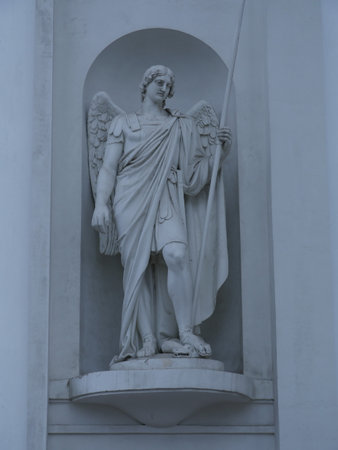 Statue of Archangel Michael with a spear striking a snakeのeditorial素材