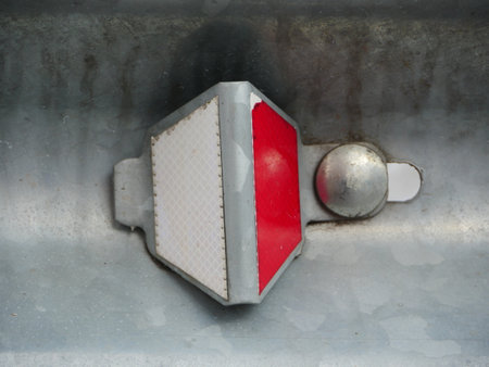 road reflector red and white retro-reflective optical unit close-upの写真素材