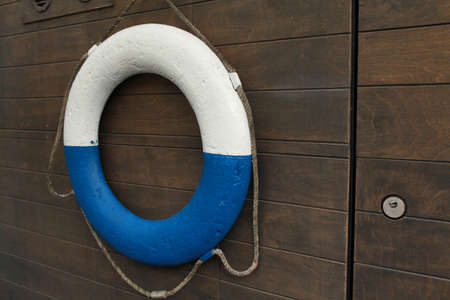 white and blue lifebuoy on board a ship close-upの写真素材