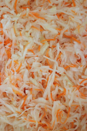 shredded sauerkraut with carrots abstract backgroundの写真素材