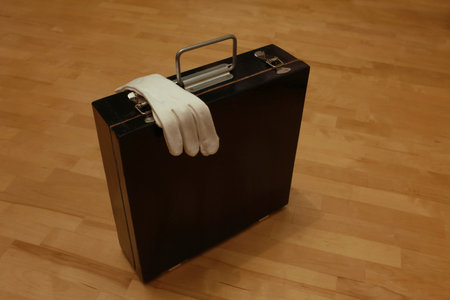Black suitcase still life Black suitcase, white gloves still life, tricks insideの写真素材