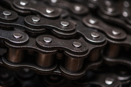Industrial driving roller chain close-up.の写真素材