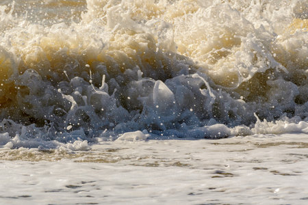 Powerful wave exploding on a beach. sea storm.