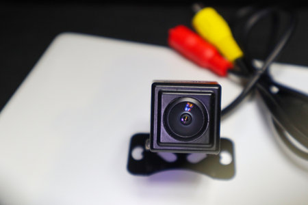 Capture the essence of automotive innovation with this black car rear camera. It seamlessly...