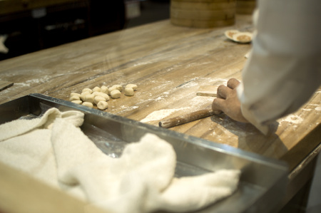 A chef is making a chinese dumplings