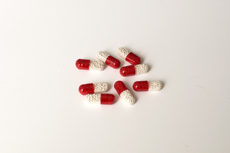 A still life shot of red and white prescription medicinesの写真素材