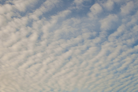 A photograph of white clouds against blue sky during day timeの写真素材