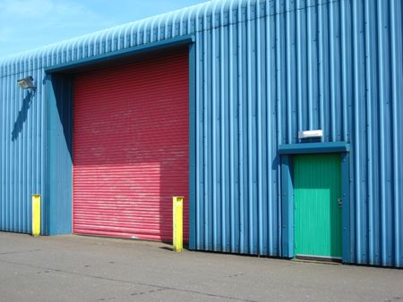 Colourful factory with bright wall, doors and posts
