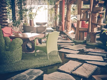 Available metal chair and wooden table in restaurant, canteen or cafeの写真素材