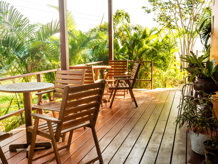 Wooden chairs and table in coffee room on  morning in the sunlightの写真素材