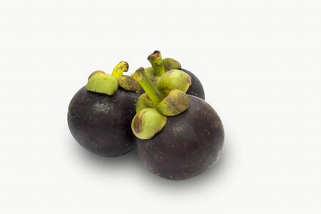 Mangosteen isolated on white background. The famous delicious fruit from Thailand or call The Queen of Fruits.の写真素材