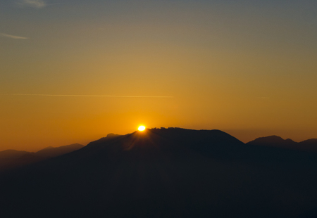 Fiery sunset from mountain pick in a clean evening. Fall season. Orobie alps.の写真素材