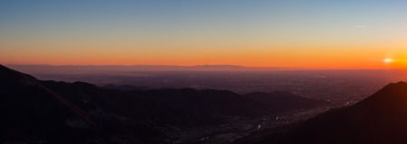 Fiery sunset from mountain pick with thin glazes in the evening sky. Fall season. Orobie alps. The summit of Mount Rena. Bergamo Italy.の写真素材