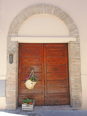 Plants and flowers in pots on narrow streets of the ancient village of Spello, Umbria, Italyのeditorial素材
