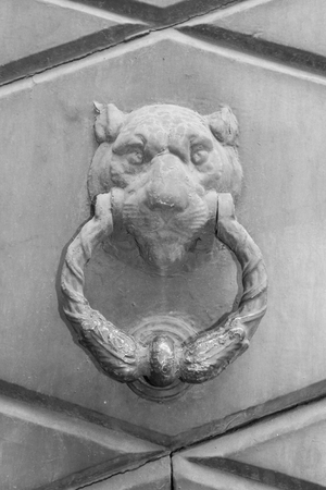 Doorknocker on the front door of the Italian buildingのeditorial素材